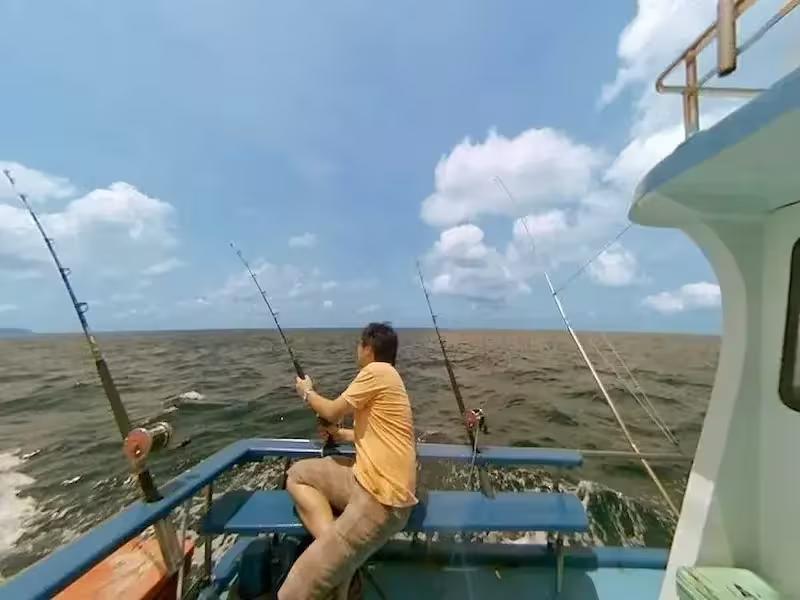 Family enjoying a sport fishing trip together on a charter tour from Phuket