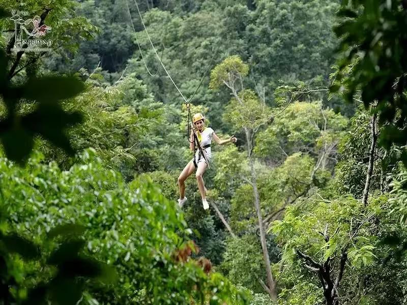 A family enjoying a tandem zipline ride together at Hanuman World Phuket