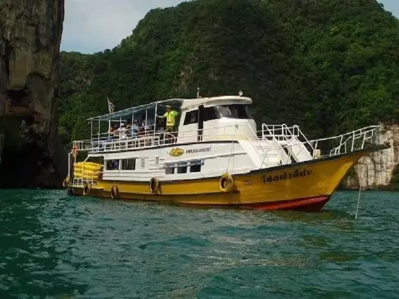 Paddling a John Gray's Sea Canoe into a hidden hong (lagoon) in Phang Nga Bay on the Hong by Starlight tour.