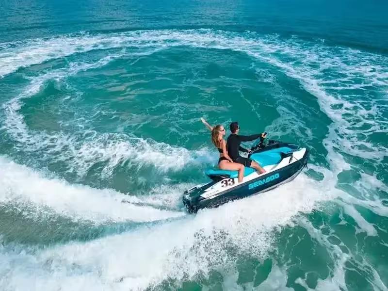 Speeding across the turquoise water on a powerful jet ski from Ao Po Pier