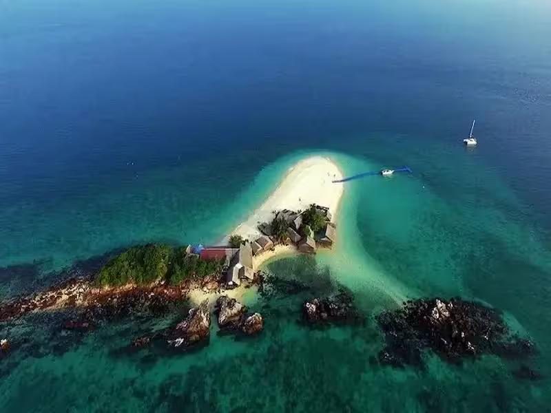 Aerial view of Khai Nai Island's stunning white sand beach and turquoise water, Phuket