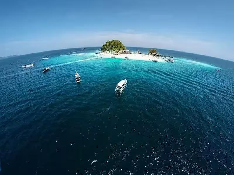 Snorkeling in the vibrant coral reefs around Khai Nok Island on a tour from Phuket