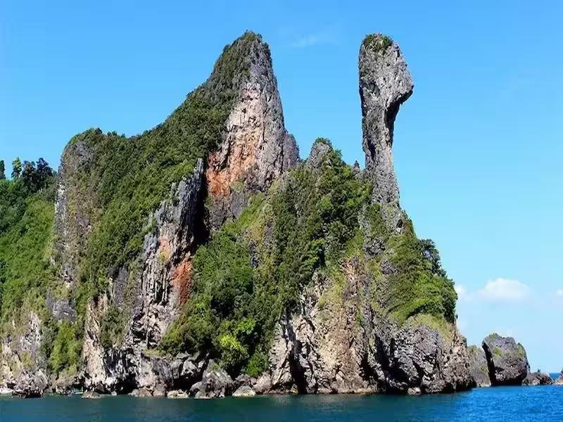Iconic view of the chicken-shaped limestone rock at Chicken Island, Krabi