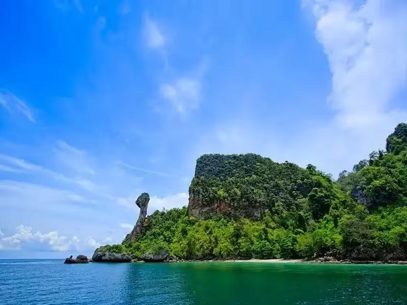 Approaching the dramatic cliffs of Chicken Island by speedboat on a Krabi islands tour