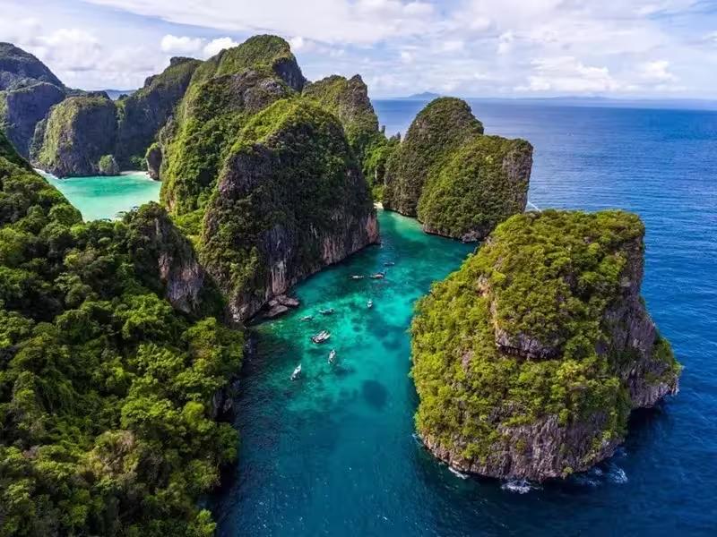 Snorkeling in Loh Samah Bay's coral gardens with tropical fish