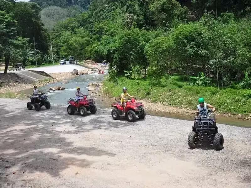Riding an ATV on a jungle trail in Phanh Nga