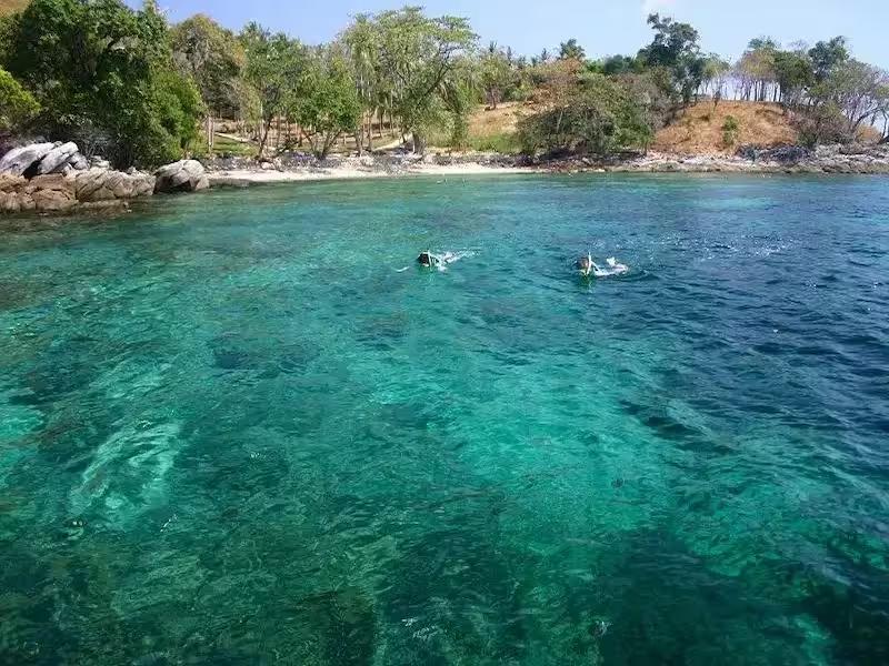 Snorkeling in the vibrant coral reefs at Kon Kare Bay, Raya Yai Island