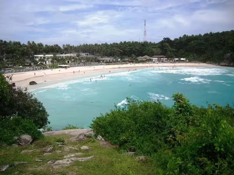 Beautiful white sand beach at Patok Bay, Raya Yai Island on a speedboat tour from Phuket